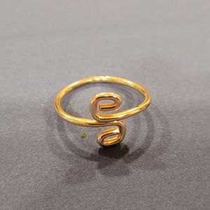 Gold colored swirl ring
